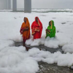 Devotees doing Chhat Puja amidst Toxic Foam in River Yamuna in Delhi